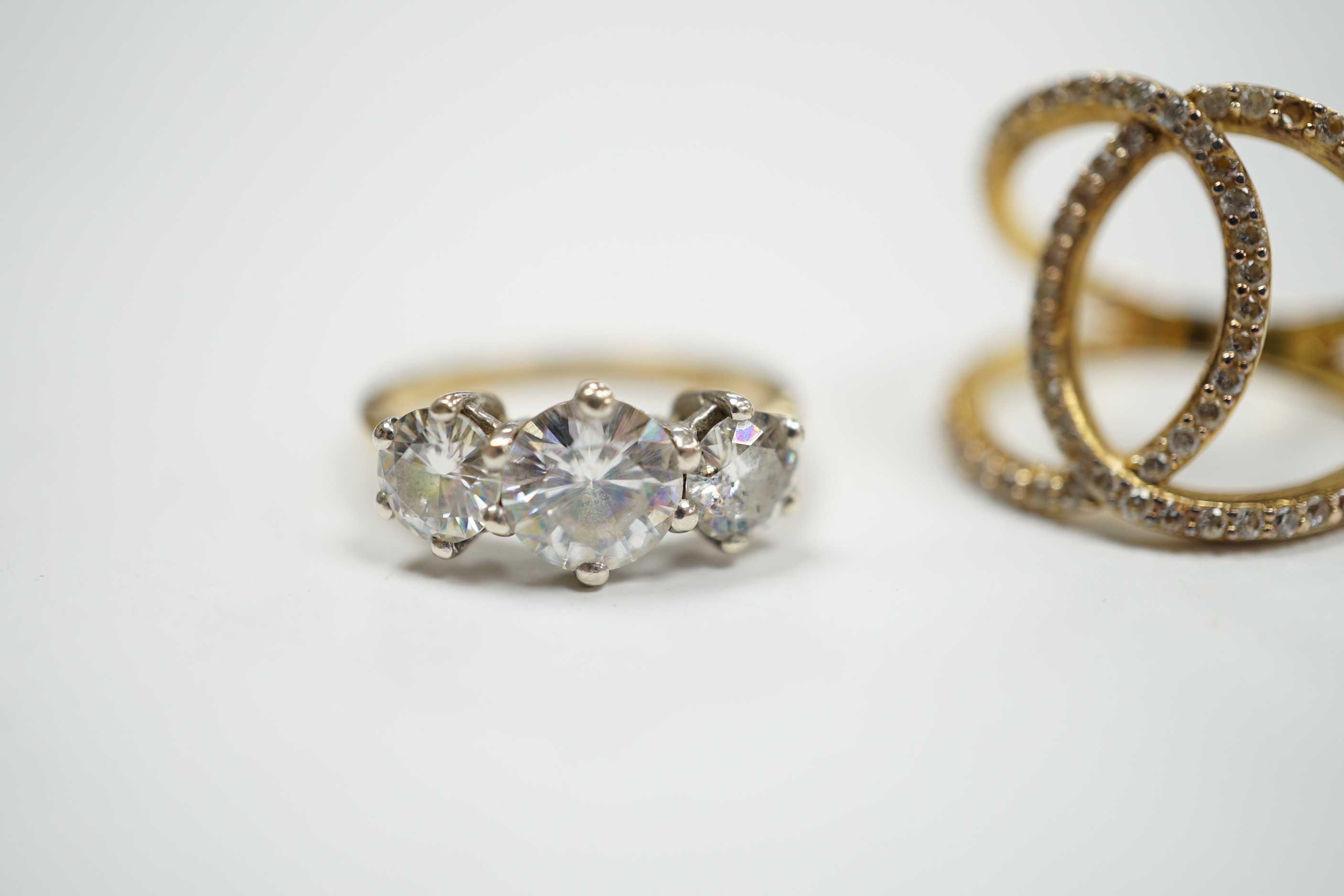 A 9ct gold and three stone simulated diamond ring and a gilt 925 ring.